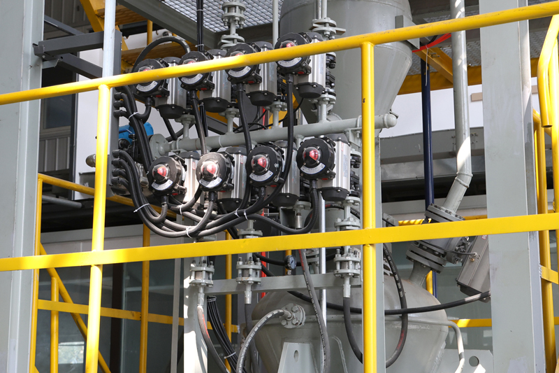 A bank of ceramic valves installed in industrial process equipment